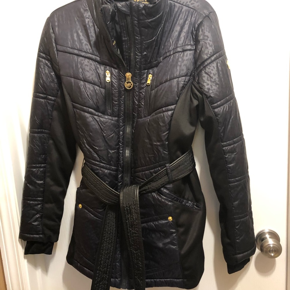 Michael Kors black puffy coat with zip front and 2 top zip & 2 slash pockets.